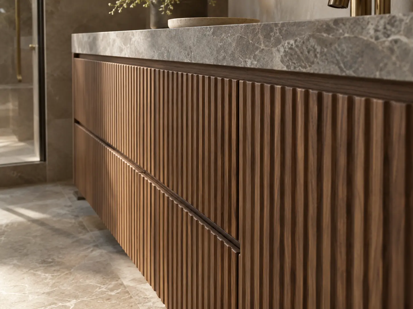 Fluted walnut vanity millwork detail with stone countertop edge